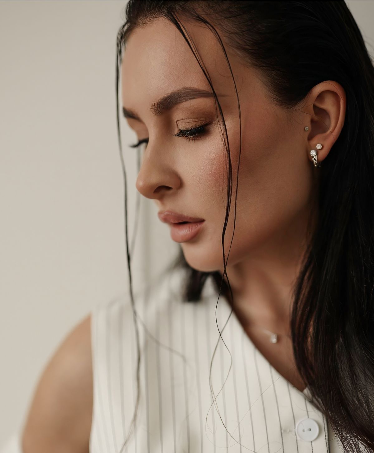 Profile of a woman with long dark hair.