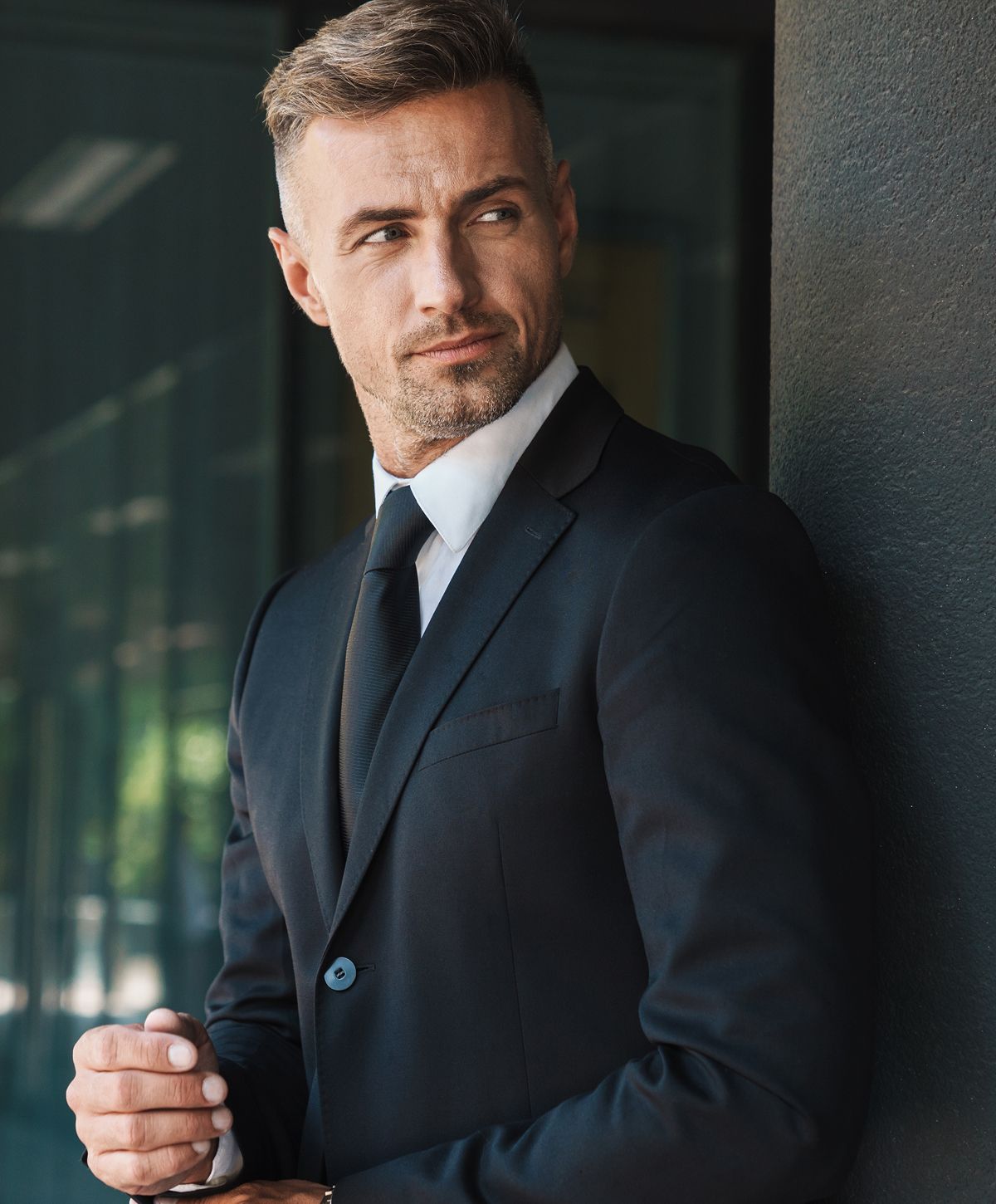 Man in suit with thoughtful expression.